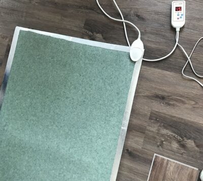 SPC floor underfloor heating installation in a modern living room